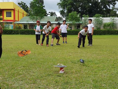 How to play Tumbang Preso in Philippines: mechanics, picture, history.